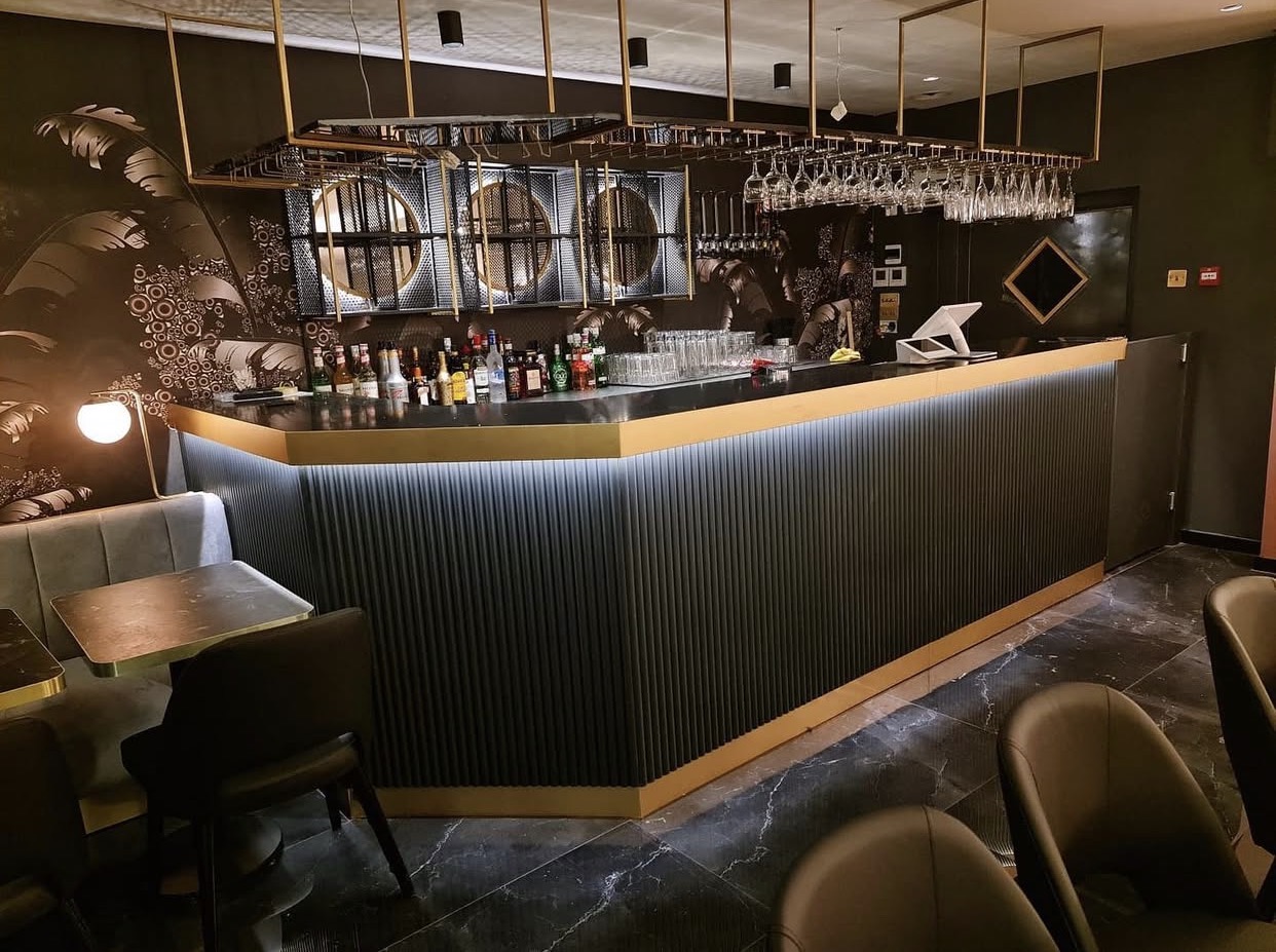 Warm lighting and intimate tables in the Deluxe Manna restaurant
